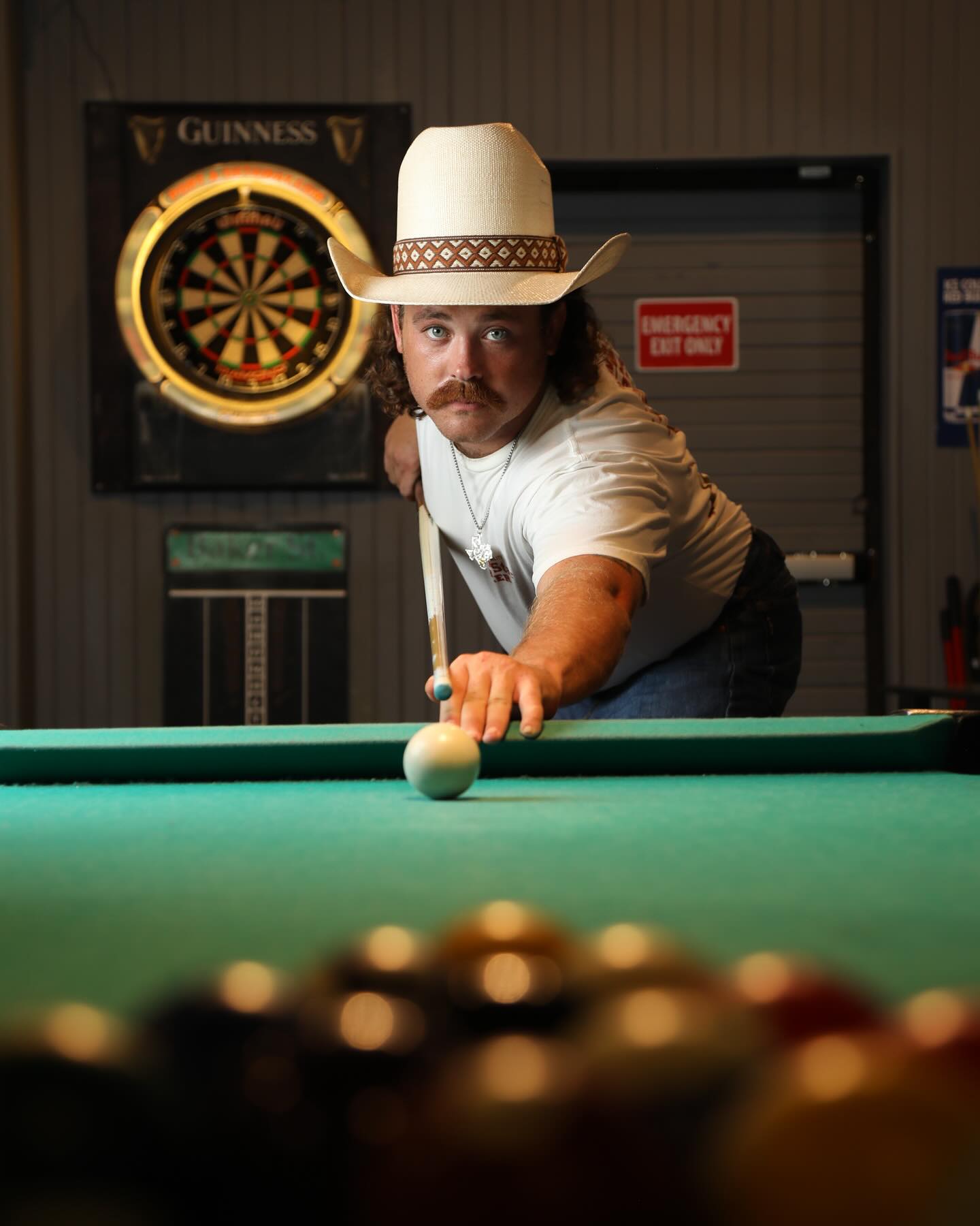 Dean Stanfield lining up a shot at a pool table