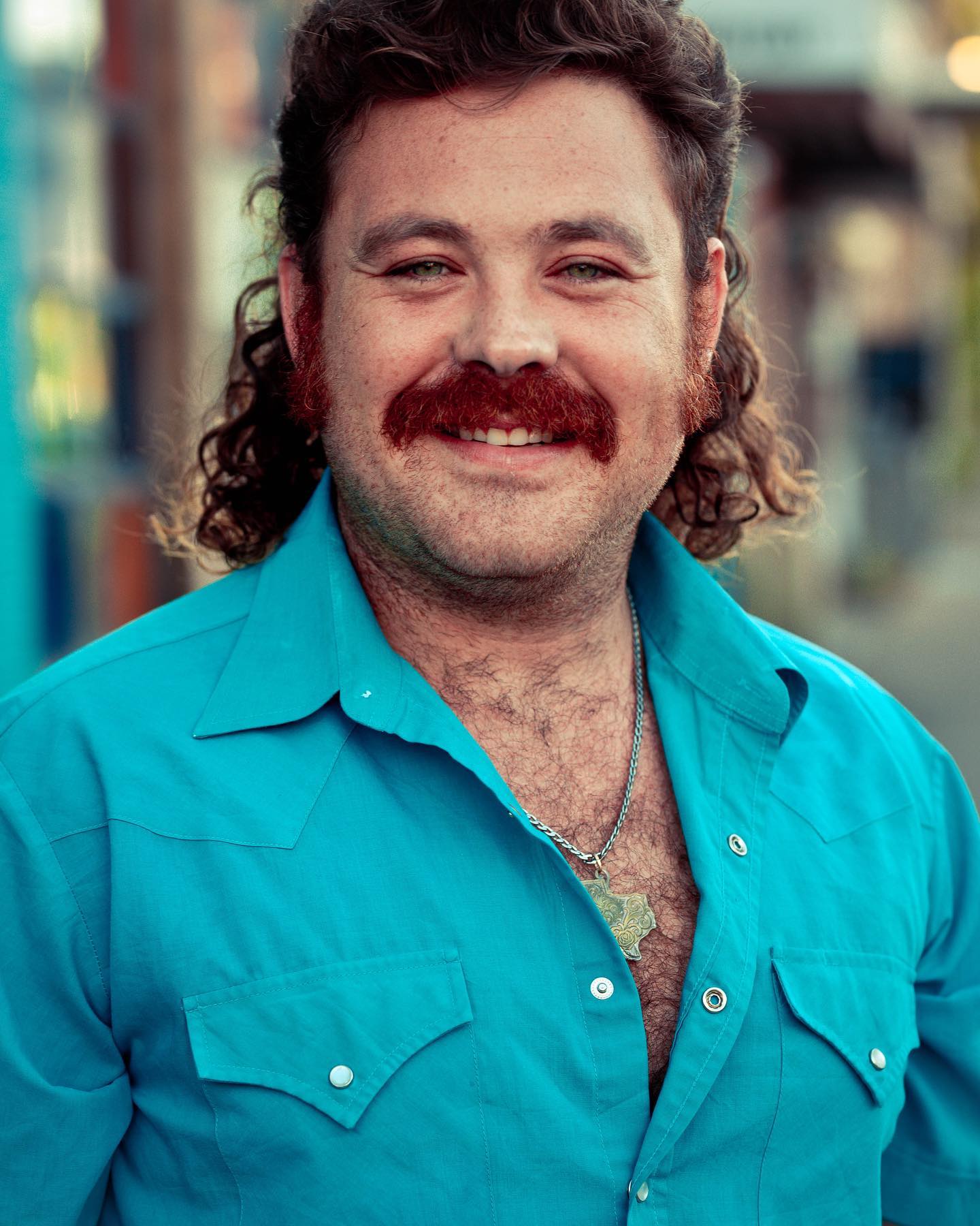 Dean Stanfield in a teal western shirt