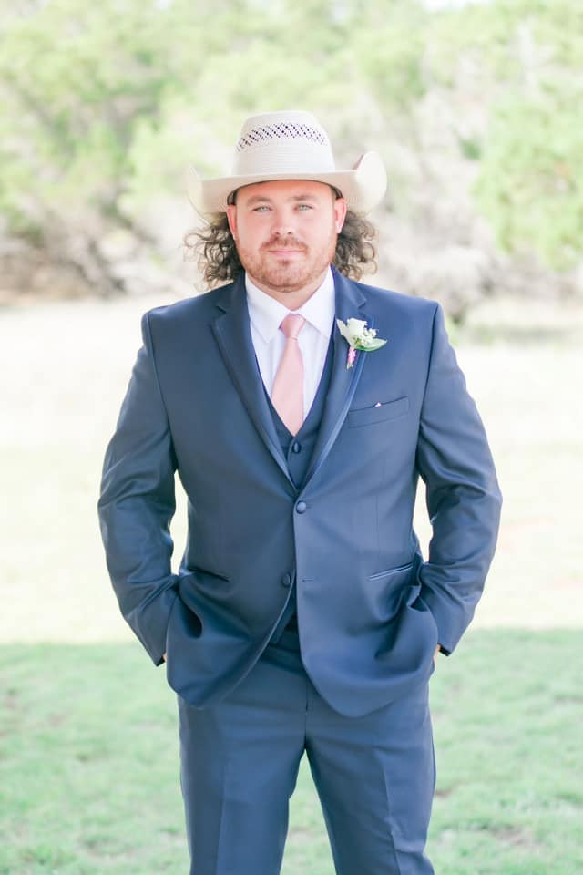 Dean Stanfield in a suit at a wedding